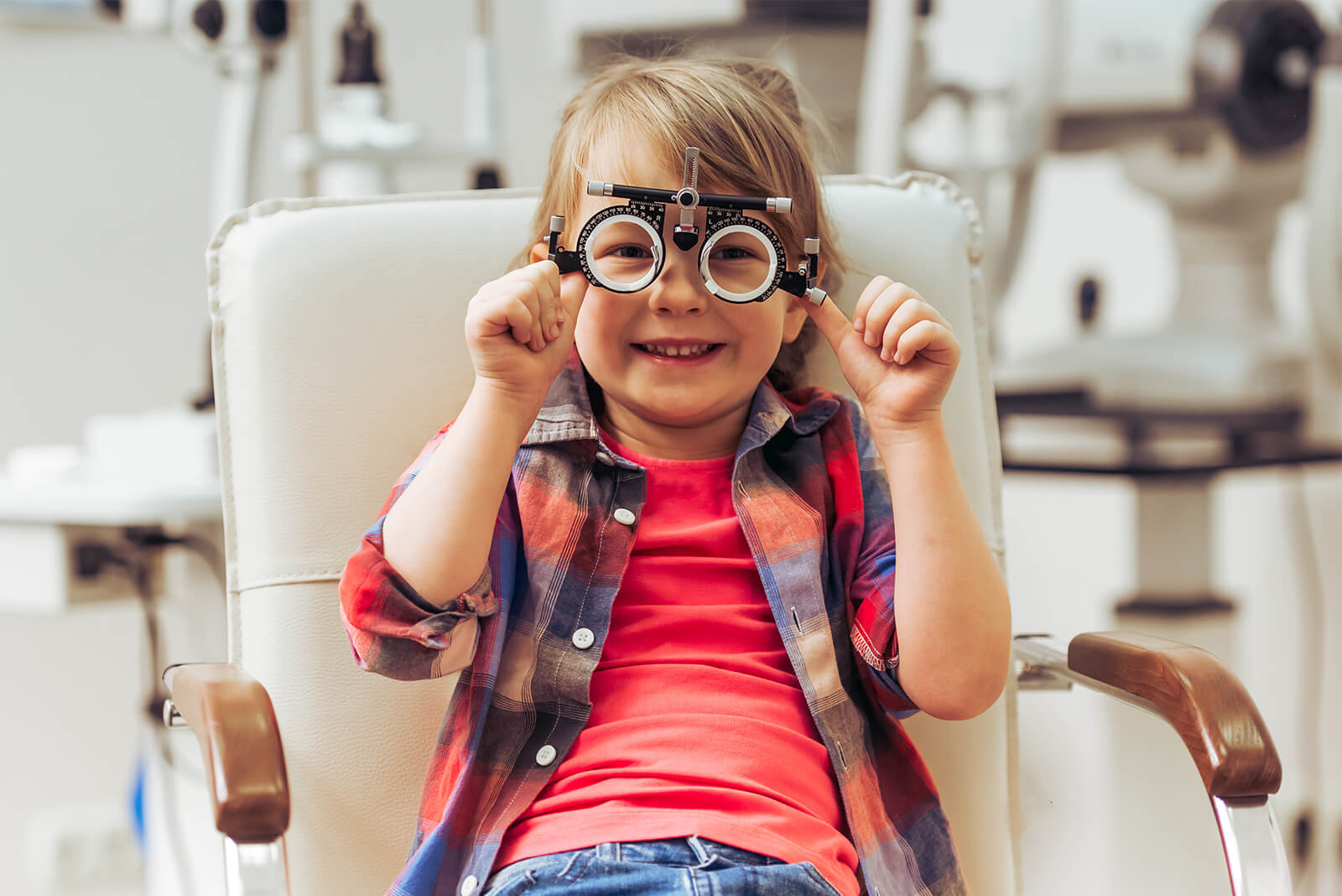 Smiling Child Having an Eye Exam